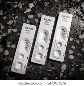 Doctor Holding A Malaria Test Kit In A Hospital