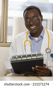 Doctor Holding Medical File, Smiling, Front View, Portrait