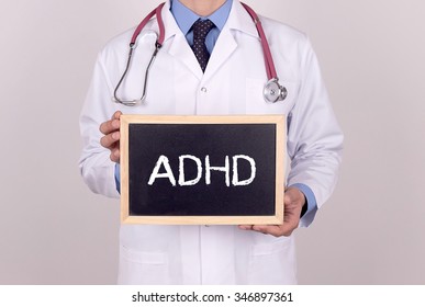 Doctor Holding Mini Blackboard With ADHD Message