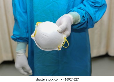 Doctor Holding N95 Mask