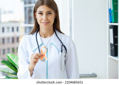 Doctor Holding Orange Ribbon, Leukemia Cancer Awareness And Multiple Sclerosis