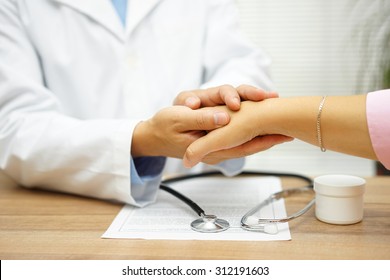 Doctor Holding Patient Hand With Compassion And Comfort