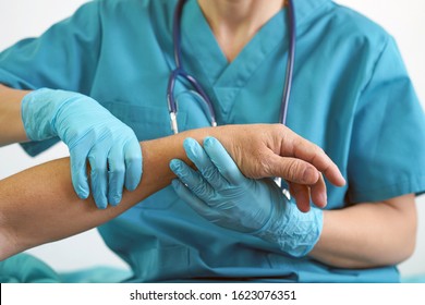 Doctor Holding Patient Hand, Examination Of Patients In The Hospital. Surgeon, Surgical Doctor, Anesthetist Holding Hand Elderly Patient. Professional Surgery, Therapy, Medical Recovery Concept.