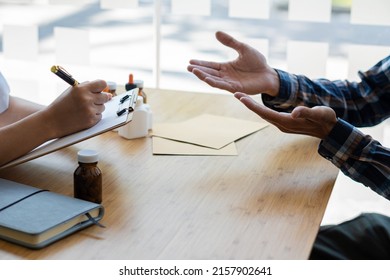 Doctor Holding A Pen To Talk To Patient About Medication And Treatment Healthcare And Medical Concepts The Patient Listened Attentively To The Female Doctor Explaining The Patient's Condition.