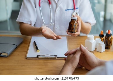 Doctor Holding A Pen To Talk To Patient About Medication And Treatment Healthcare And Medical Concepts The Patient Listened Attentively To The Female Doctor Explaining The Patient's Condition