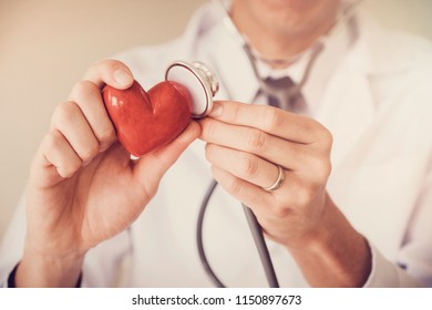 Doctor Holding Red Heart With Stethoscope, Heart Health,  Health Insurance, Telehealth, Online Consulting Concept