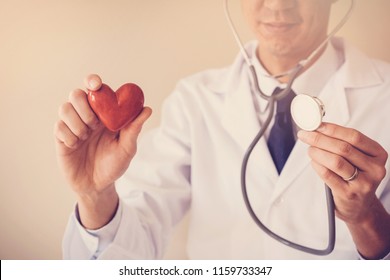 Doctor Holding Red Heart With Stethoscope, Heart Health,  Health Insurance, Telehealth, Online Consulting Concept