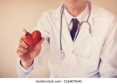 Doctor Holding Red Heart With Stethoscope, Heart Health,  Health Insurance, Telehealth, Online Consulting Concept