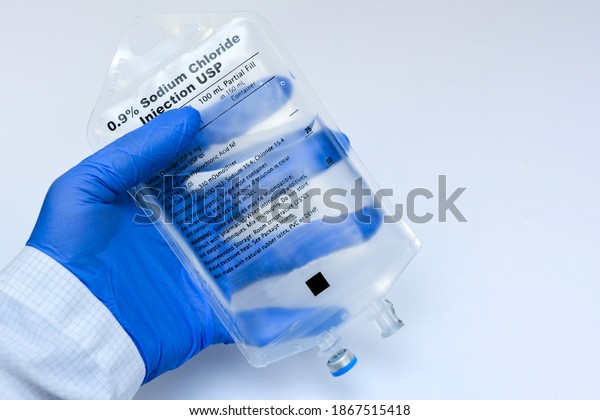 Doctor Holding Saline IV\
Bag