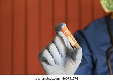 Doctor Holding Stem Cell Research Vial