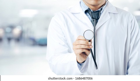 Doctor holding stethoscope listening something.Medicine and healthcare concept