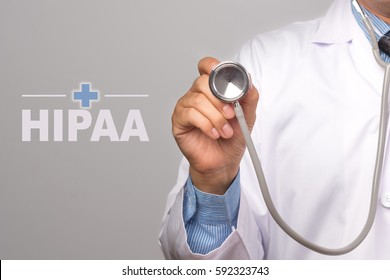 Doctor holding a stethoscope and word "HIPAA" on gray background. concept Healthy.