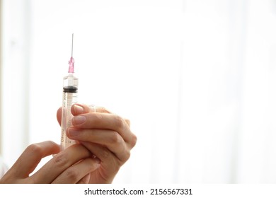 doctor holding a syringe for injection to treat sickness to patients. Concept of medical services in hospitals. prophylactic vaccine - Shutterstock ID 2156567331
