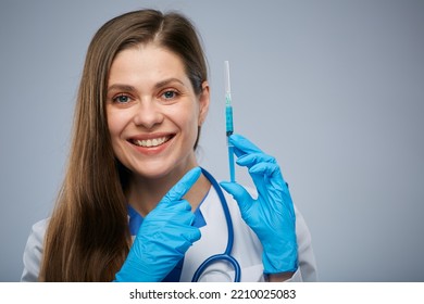 Doctor Holding Syringe With Vaccine, Pointing Finger. Isolated Female Medical Worker Portrait.