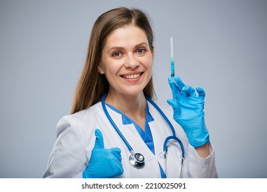 Doctor Holding Syringe With Vaccine And Showing Thumb Up. Isolated Female Medical Worker Portrait.