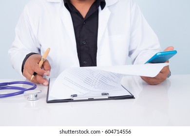 Doctor Holding A Tablet With Message,