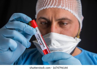 
Doctor Holding A Test Tube With The Label 