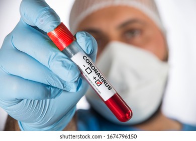 
Doctor Holding A Test Tube With The Label 