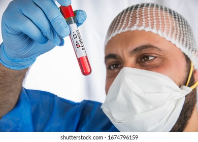 
Doctor Holding A Test Tube With The Label 