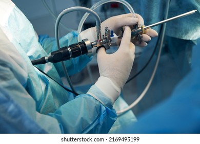 Doctor holding thin light tube used for hysteroscopy - Shutterstock ID 2169495199