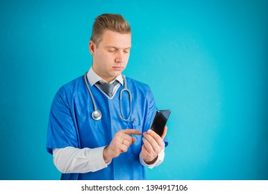 Doctor Holding And Using Mobile Phone