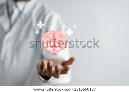 Doctor holding virtual human brain and plus signs mental health positive thinking, idea creative intelligence thinking or Awareness with energy boost, energy or fresh wellness emotion concept.