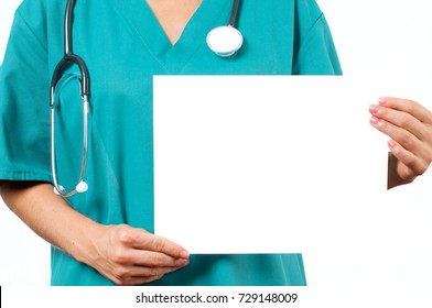 Doctor Is Holding White Board. Nurse In Green Scrubs 