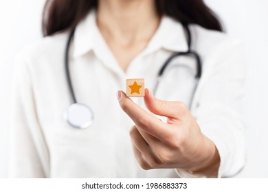 Doctor Holding Wooden Blocks With Star Symbol. Patient Reviews, Feedback, Rating, Ranking And Service Concept
