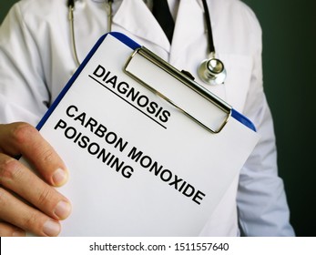 Doctor Holds Diagnosis Carbon Monoxide Poisoning.