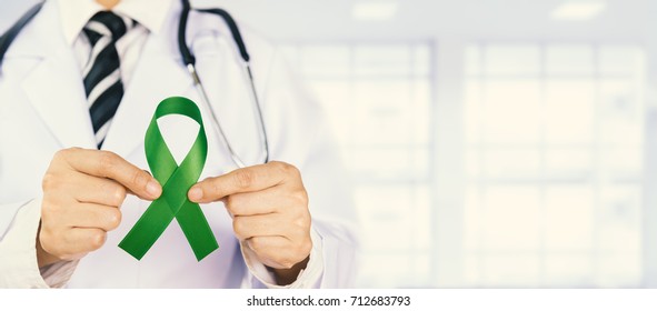 Doctor Holds Green Ribbon,  World Lymphoma Awareness Day September 15th.