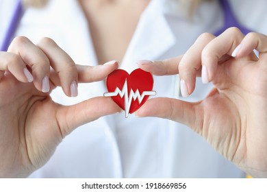 Doctor Holds In His Hands An Icon With Cardiogram Of Heart. Heart And Vascular Disease Concept