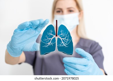 the doctor holds the lungs organ symbol. Awareness of lung cancer, pneumonia, asthma, COPD, pulmonary hypertension, world no tobacco day and eco air pollution. Respiratory and chest concept.