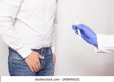 A Doctor Holds A Surgical Scalpel Against The Background Of A Man Whose Prostate Cancer Concept Of Prostate Gland Surgery Using A Prostatectomy