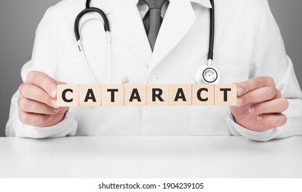 Doctor Holds Wooden Cubes In His Hands With Text CATARACT