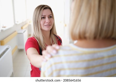 Doctor In The Hospital Corridor Talking To A Woman