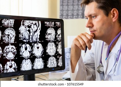 Doctor In Hospital Looking At Ct Scan