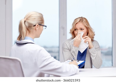 Doctor And Ill Woman Patient With Flu At Clinic