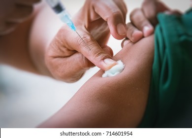 Doctor Inject Vaccine To Patient.