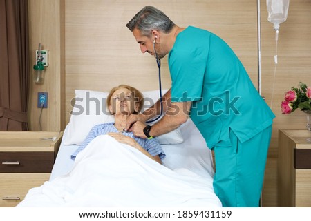 Similar – Female doctor filling questionnaire to senior patient