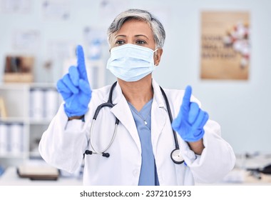 Doctor, invisible screen and woman press key on technology for healthcare, wellness and telehealth. Hands, click virtual button and mature medical professional in face mask for innovation at hospital - Powered by Shutterstock