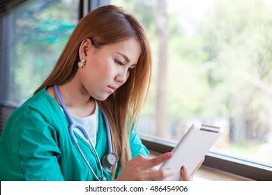 Doctor, Ipad, Health. Healthcare And Medicine. Doctor Or Nurse Using A Digital Tablet In Hospital.