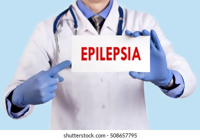 Doctor keeps a card with the name of the epilepsia. Selective focus. Medical concept.