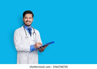 Doctor In Lab Coat Holding Patient File Or Writing Medical Recor