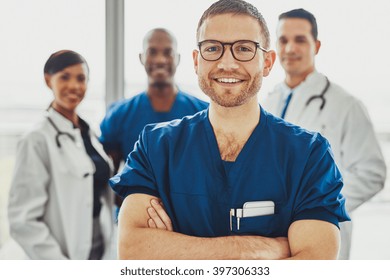 Doctor Leading A Medical Team At Hospital, Multiracial Team Of Doctors And Surgeons