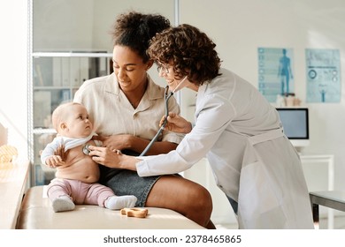 Doctor listening to child at hospital - Powered by Shutterstock