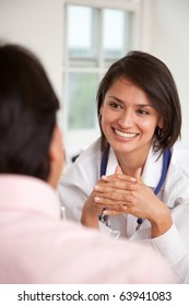 Doctor Listening To A Patient At Her Practice