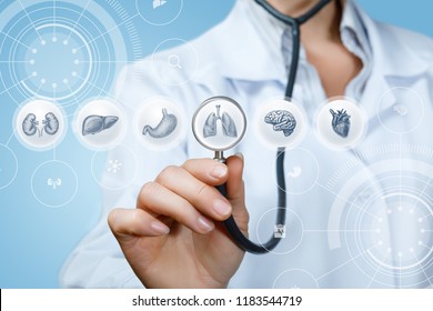 Doctor listens to the internal organs on a blue background.