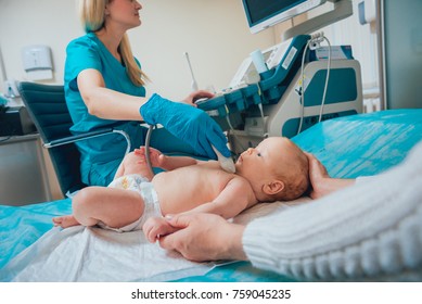 Doctor and little boy patient. Ultrasound equipment. Diagnostics. Sonography. Thyroid ultrasound