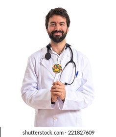 Doctor With Lolly Pop Over White Background