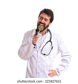 Doctor With Lolly Pop Over White Background